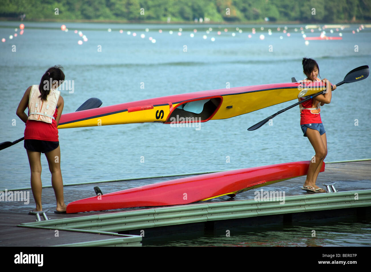 Girls prepare to canoe & kayak on the MacRitchie Reservoir Singapore
