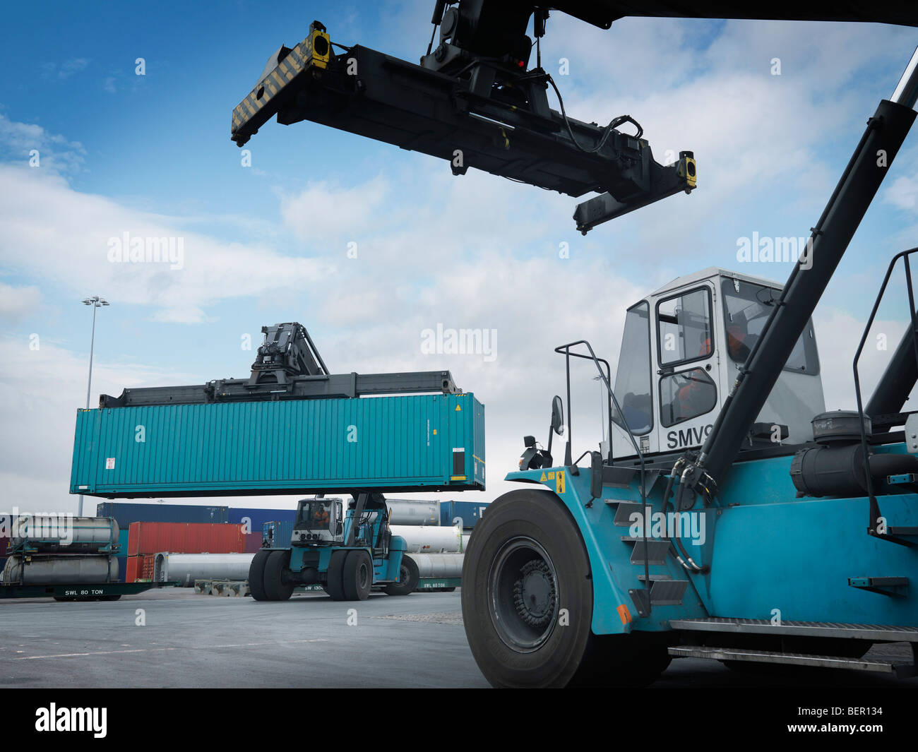 Fork Lifts Moving Shipping Containers Stock Photo