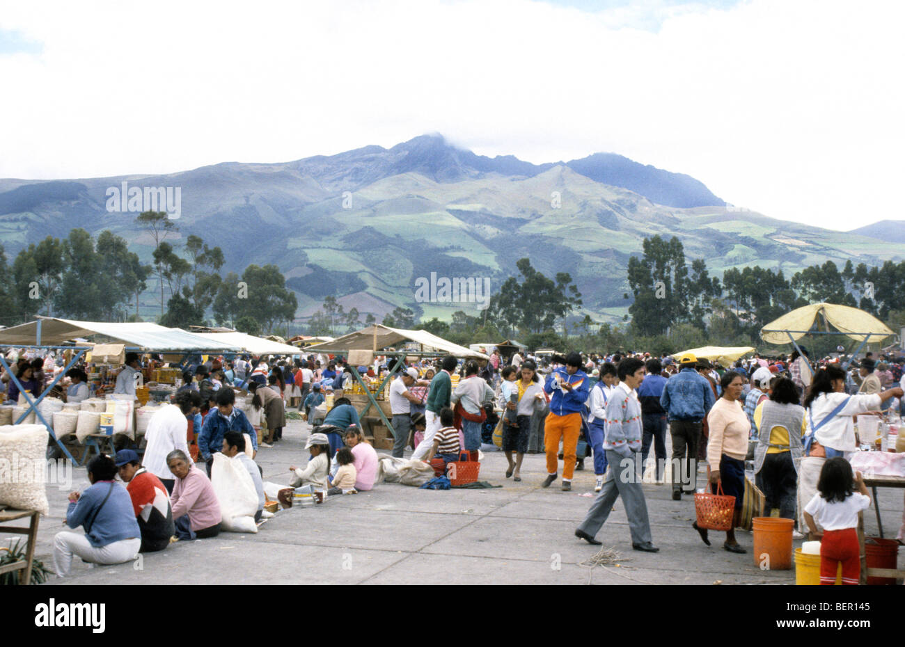 Market square in upland ecuador with large green patchwork coated mountain behind Stock Photo