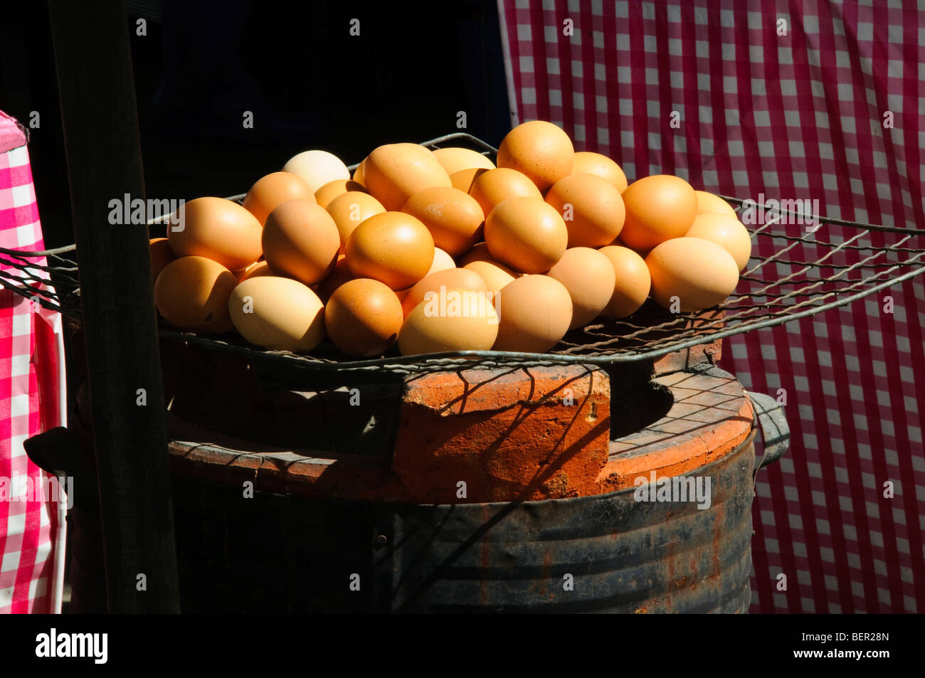 Eggs cooking over fire, Thailand Stock Photo Alamy