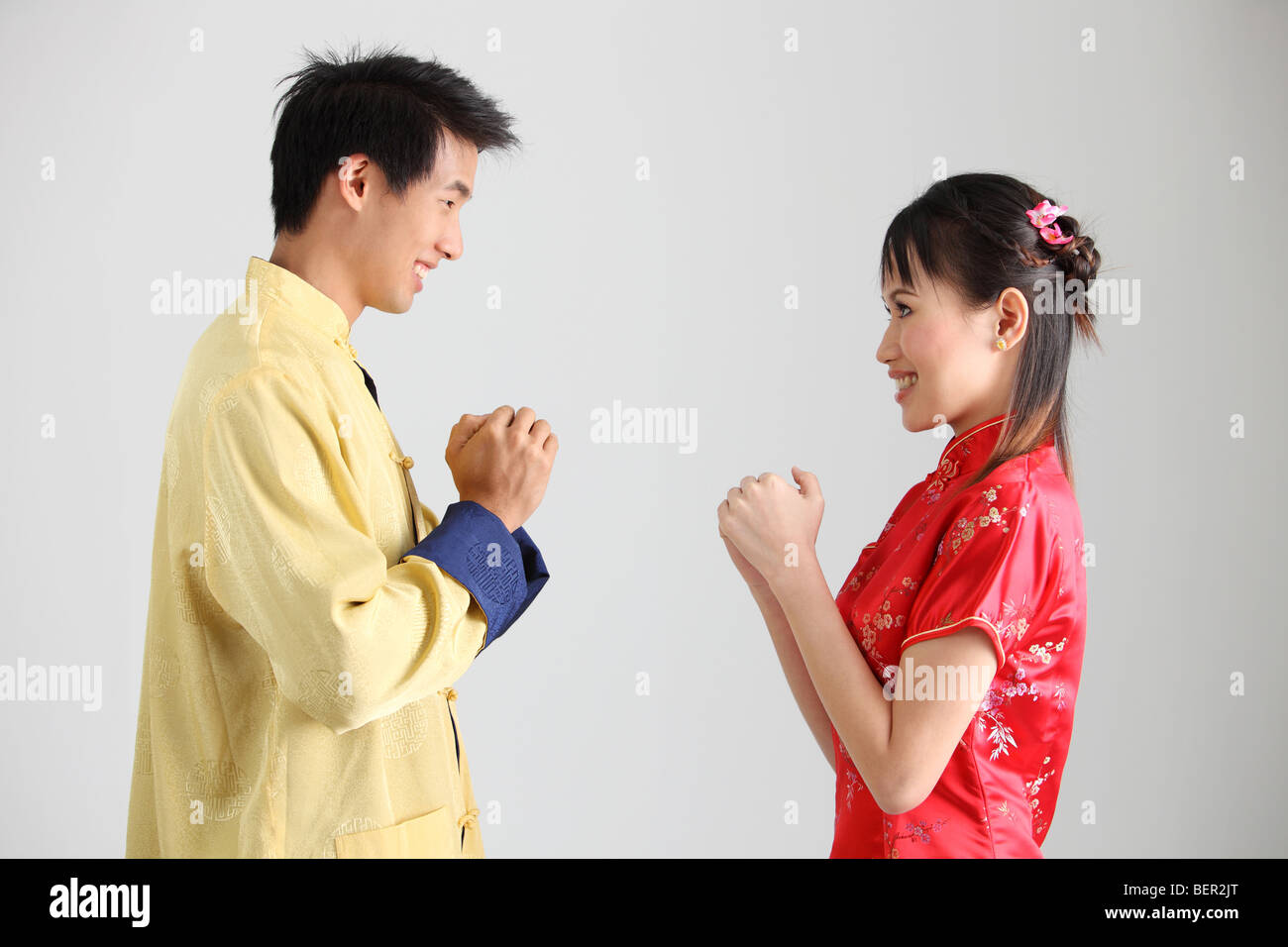 Man and woman greeting to each other Stock Photo - Alamy