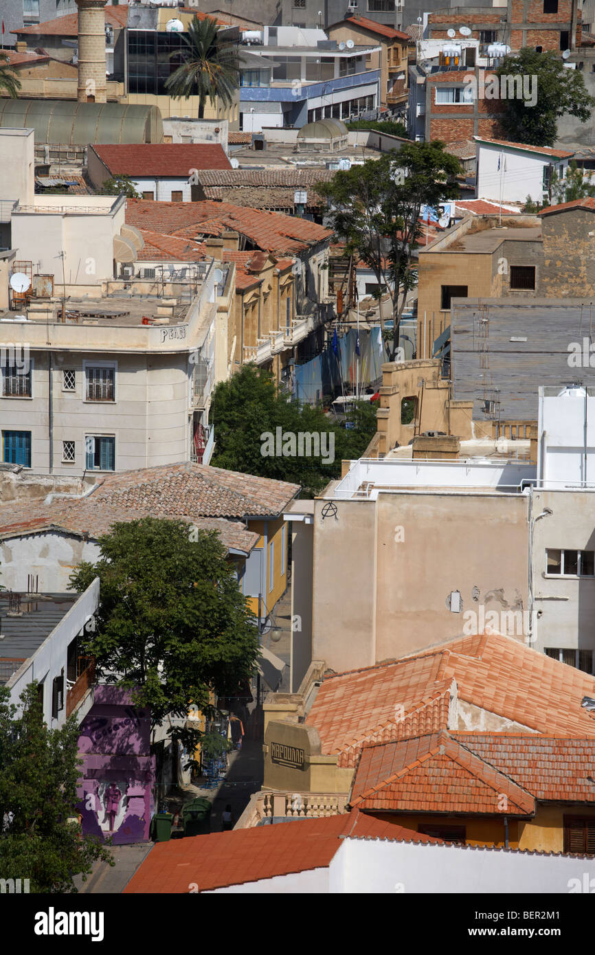 looking down over rooftops to ledra street crossing and restricted area of the UN buffer zone in the green line Stock Photo