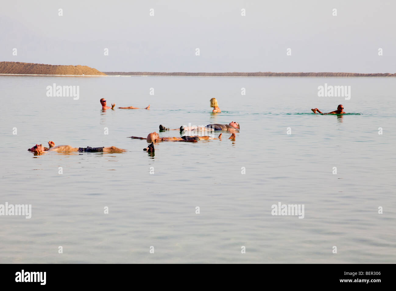 Israel, Dead Sea People float in the heavy water of the Dead Sea Stock