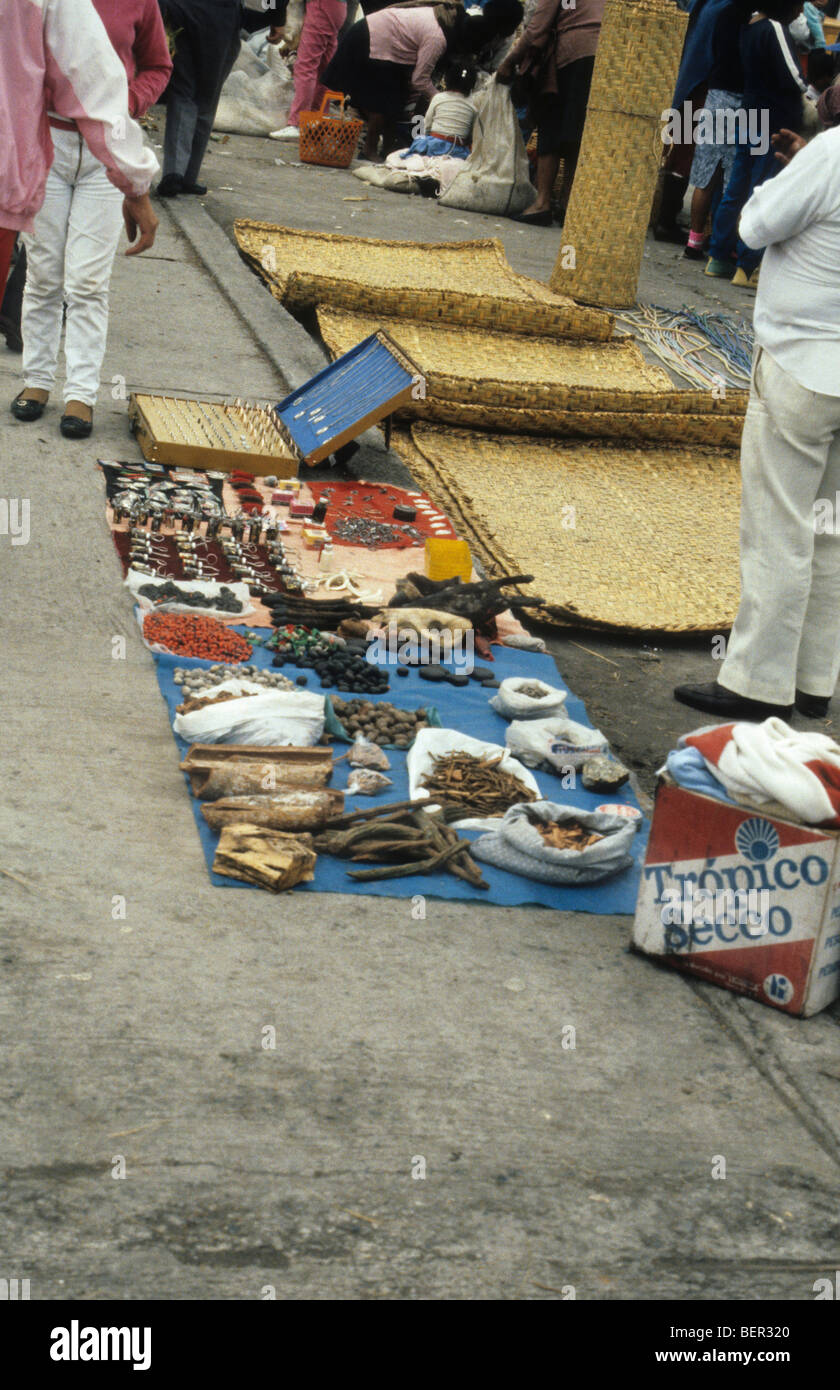 Spices and potion seller with jewelry to ward off harm.  Local Ecuadorian market. Stock Photo