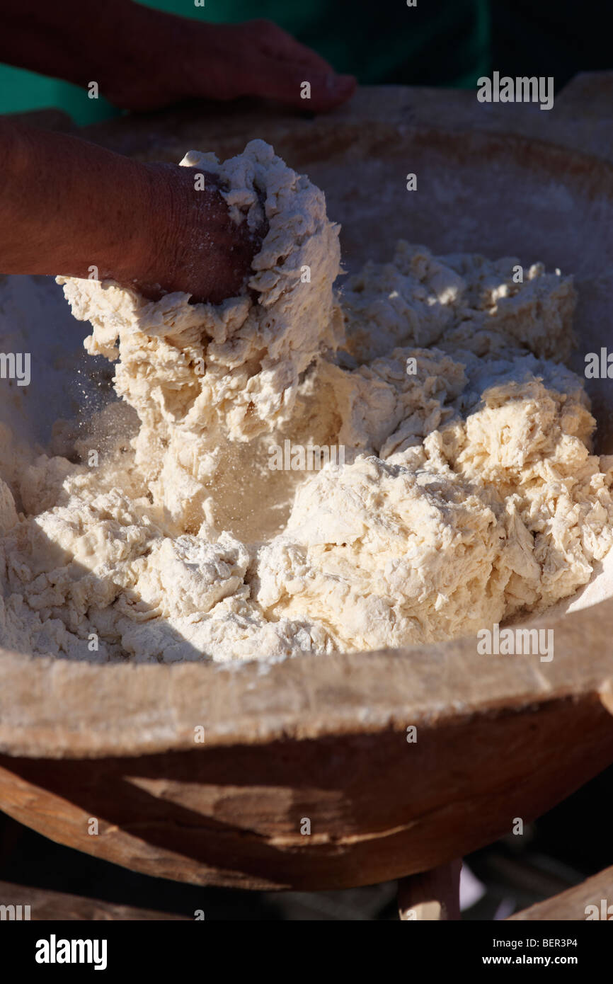 Woman [ south Alfoldi region ] [ Del Alfodi Regio South Alfoldi ]  making dough for lepeny bread. Hungary Stock Photo