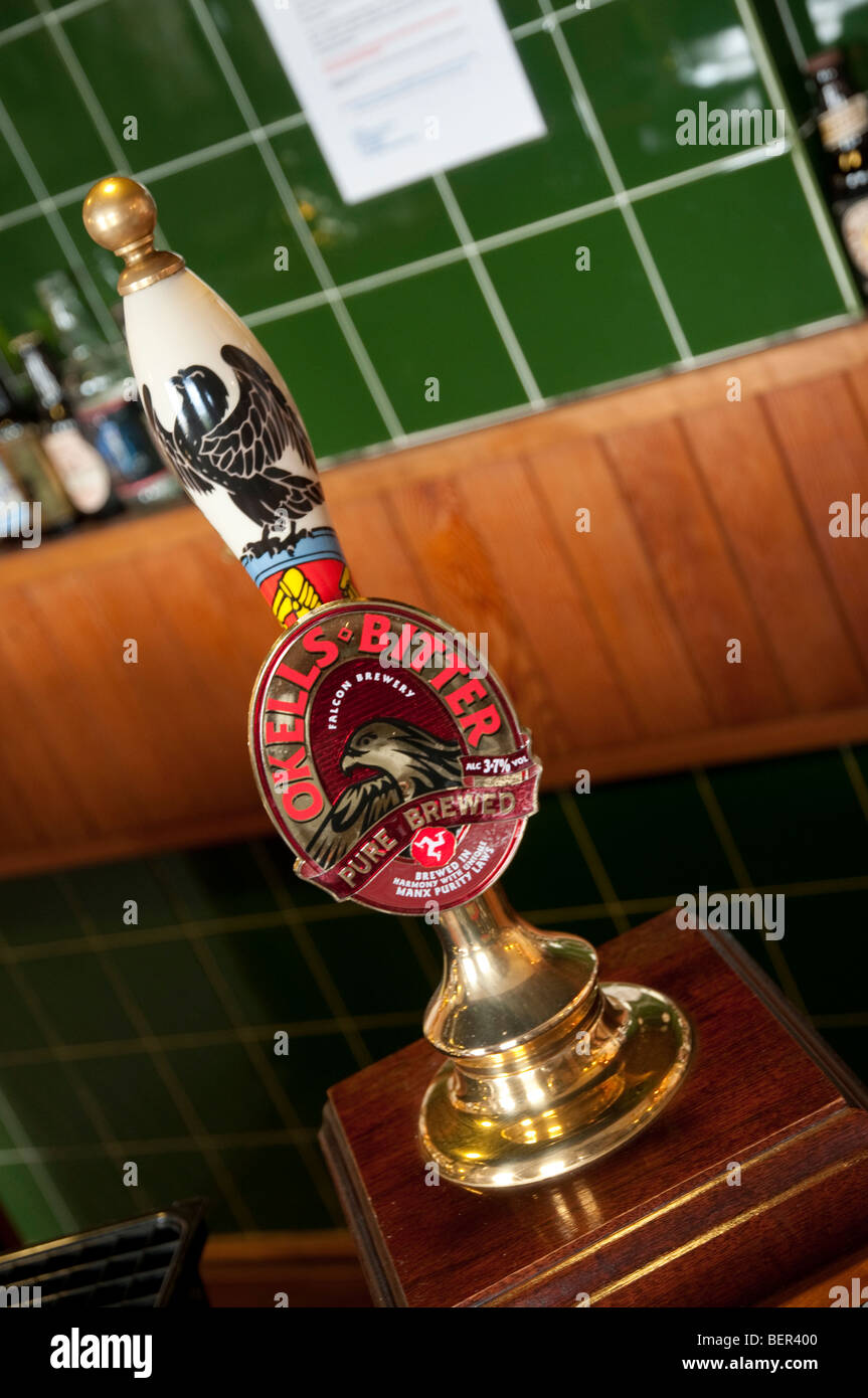 An Okells bitter handpump on a bar in the brewery bar, Douglas, Isle of Man. Stock Photo