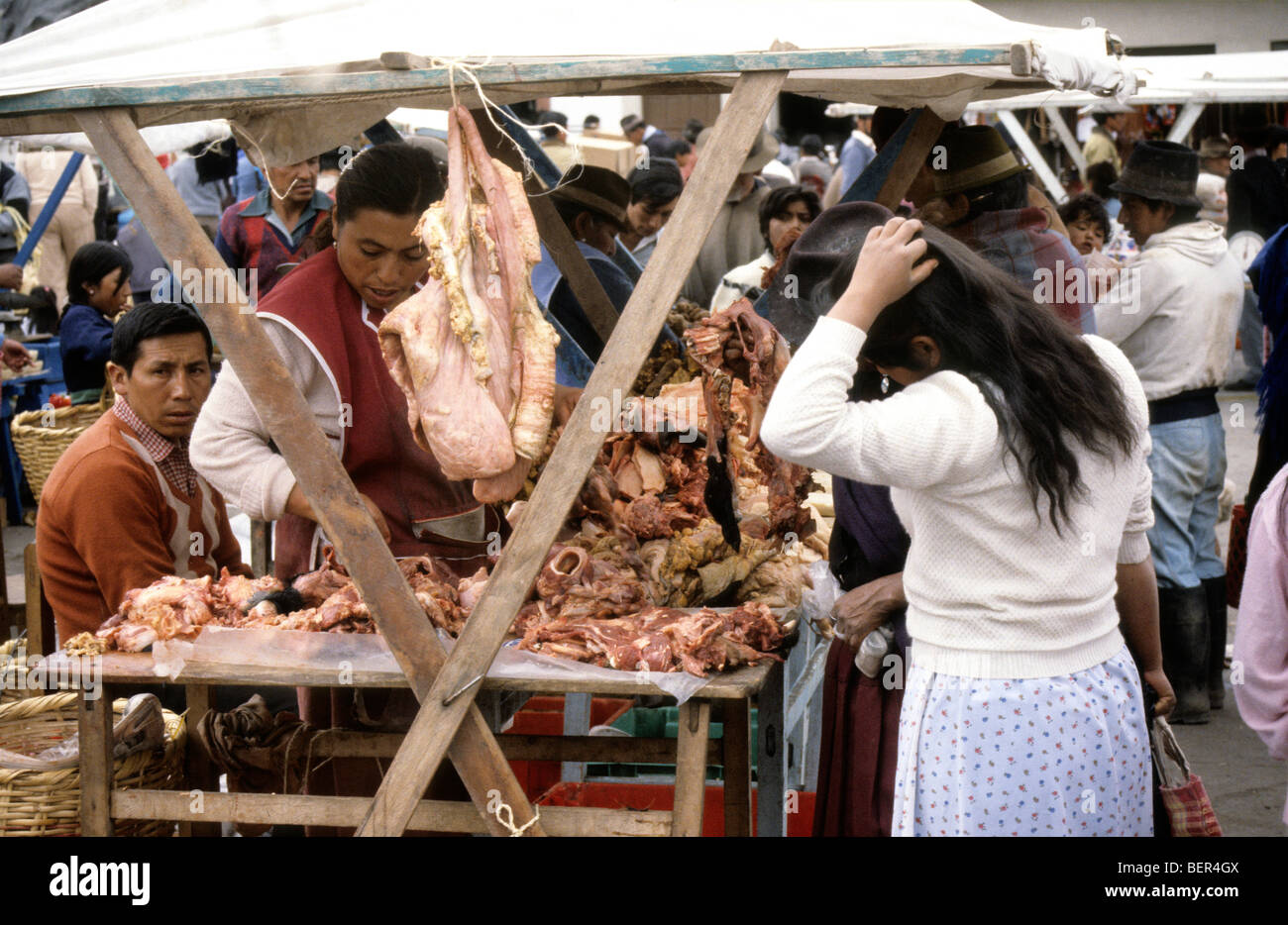 Meat stall.  Small chuncks of unidentifyable raw meat in piles on open market stall. Ecuadorian highland market Stock Photo