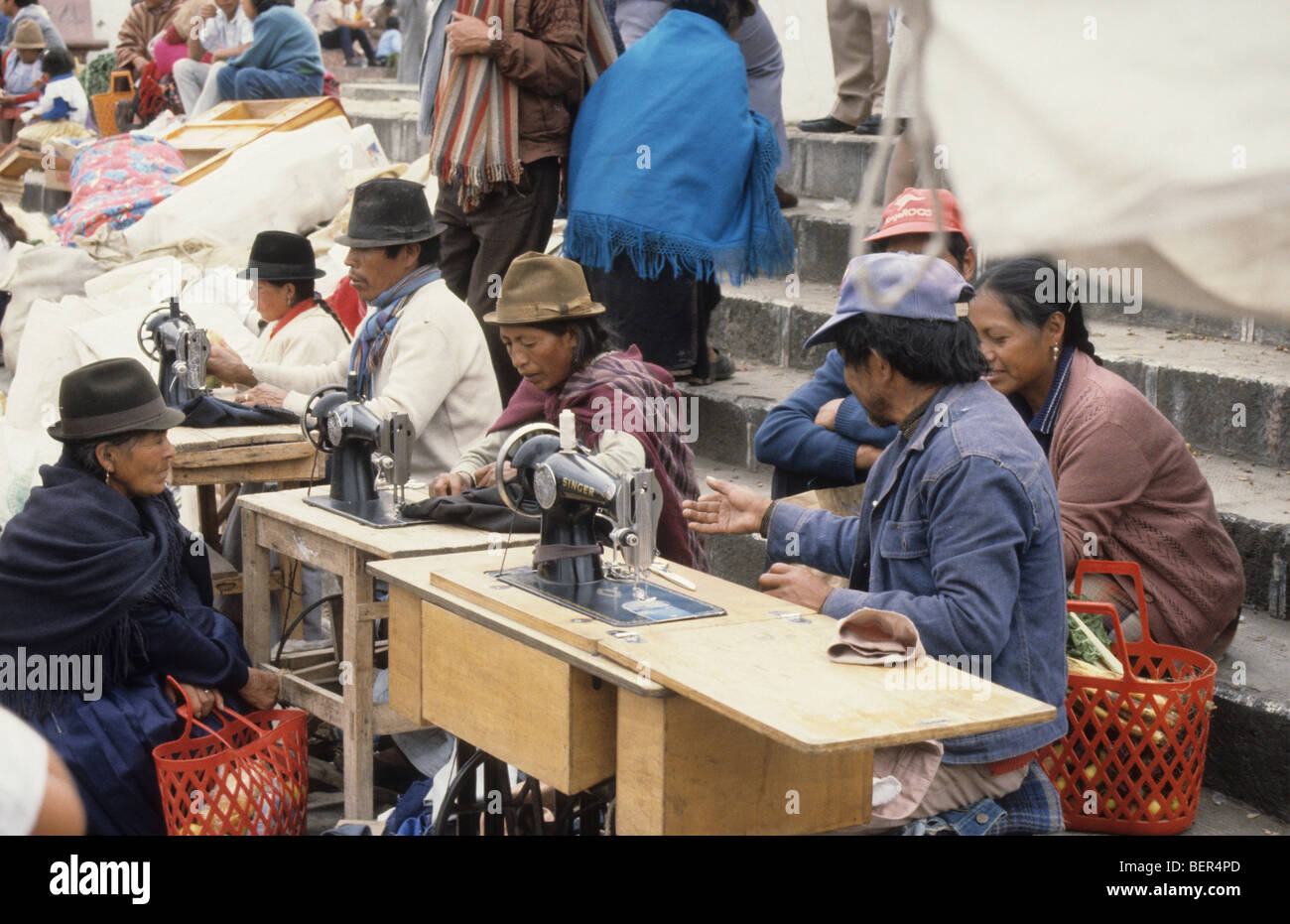 Line of tailors at edge of market.  Ecuadorian Highland Market. Stock Photo