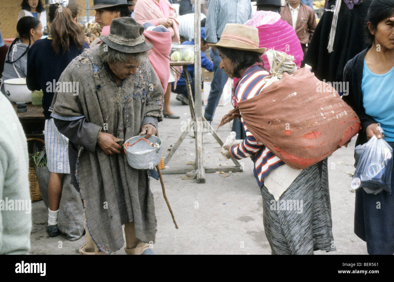 Older couple in the center of bustling Ecuadorian highland market. Stock Photo