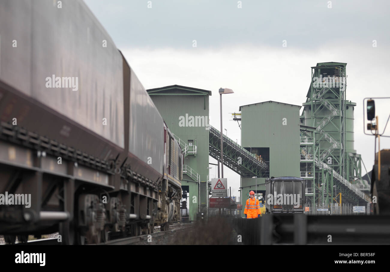 Port Worker Next To Train Stock Photo