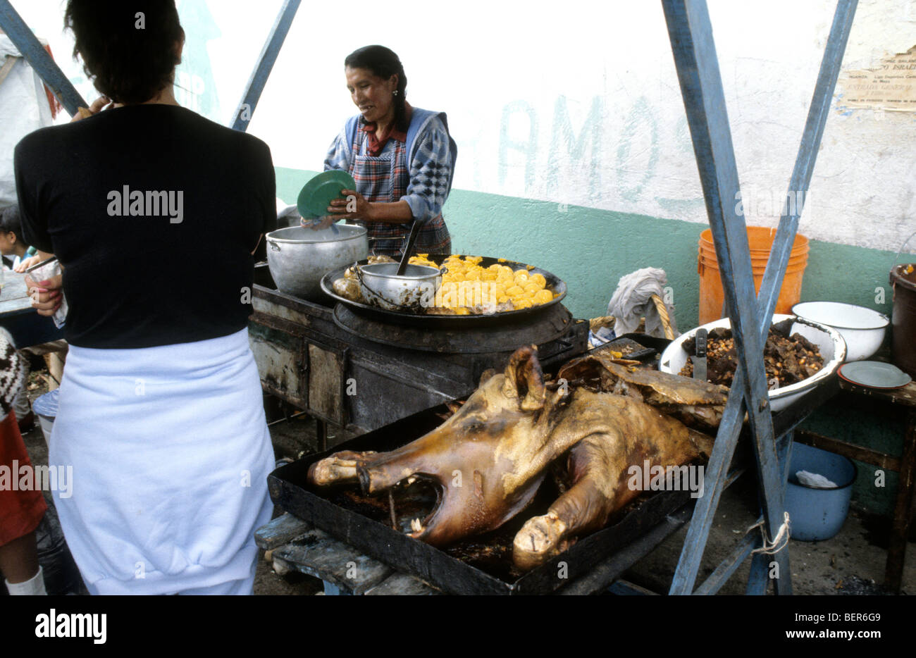 Local ecuadorian delicacy, whole roasted pig laid out on market stall. Stock Photo