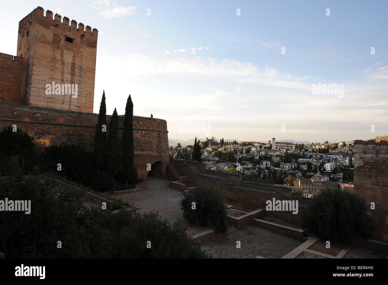 man on the Cubo de la Alhambra,  & the Torre del Homenaje (The Keep), The Alcazaba, The Alhambra, Granada, Andalusia, Spain Stock Photo