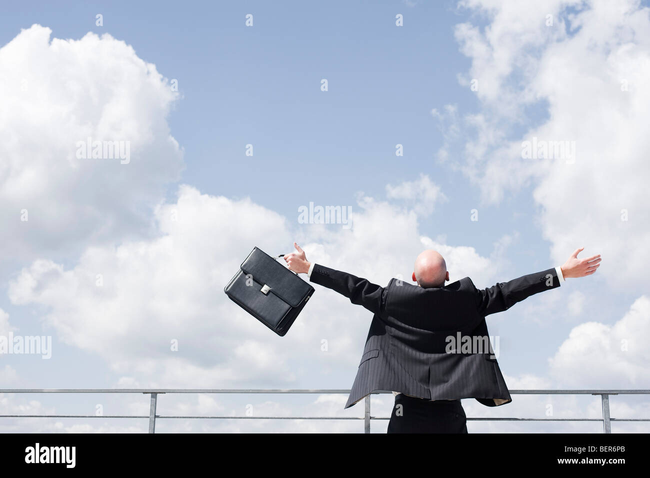 business man throwing arms in the sky Stock Photo Alamy
