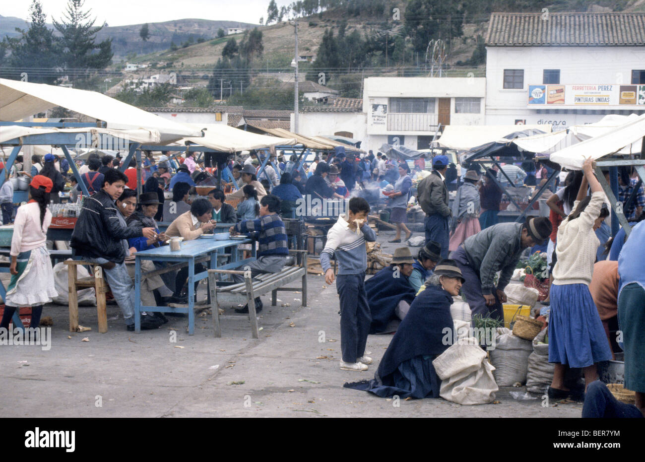 View over cooked food portion of market with smoke billowing from several stalls. Ecuador highlands local market Stock Photo
