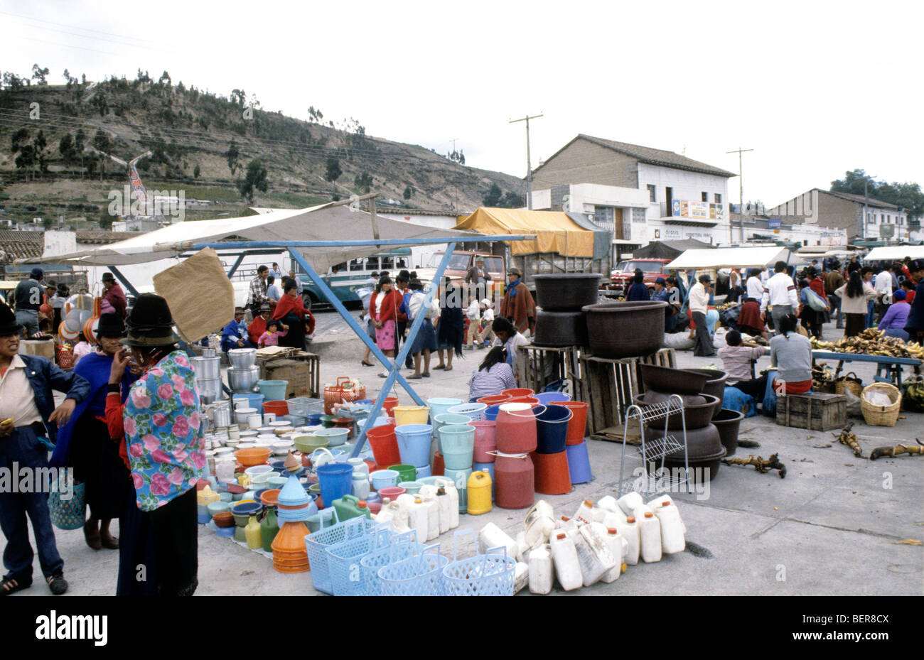 Plastic household goods seller.  Ecuadorian highlands local market. Stock Photo