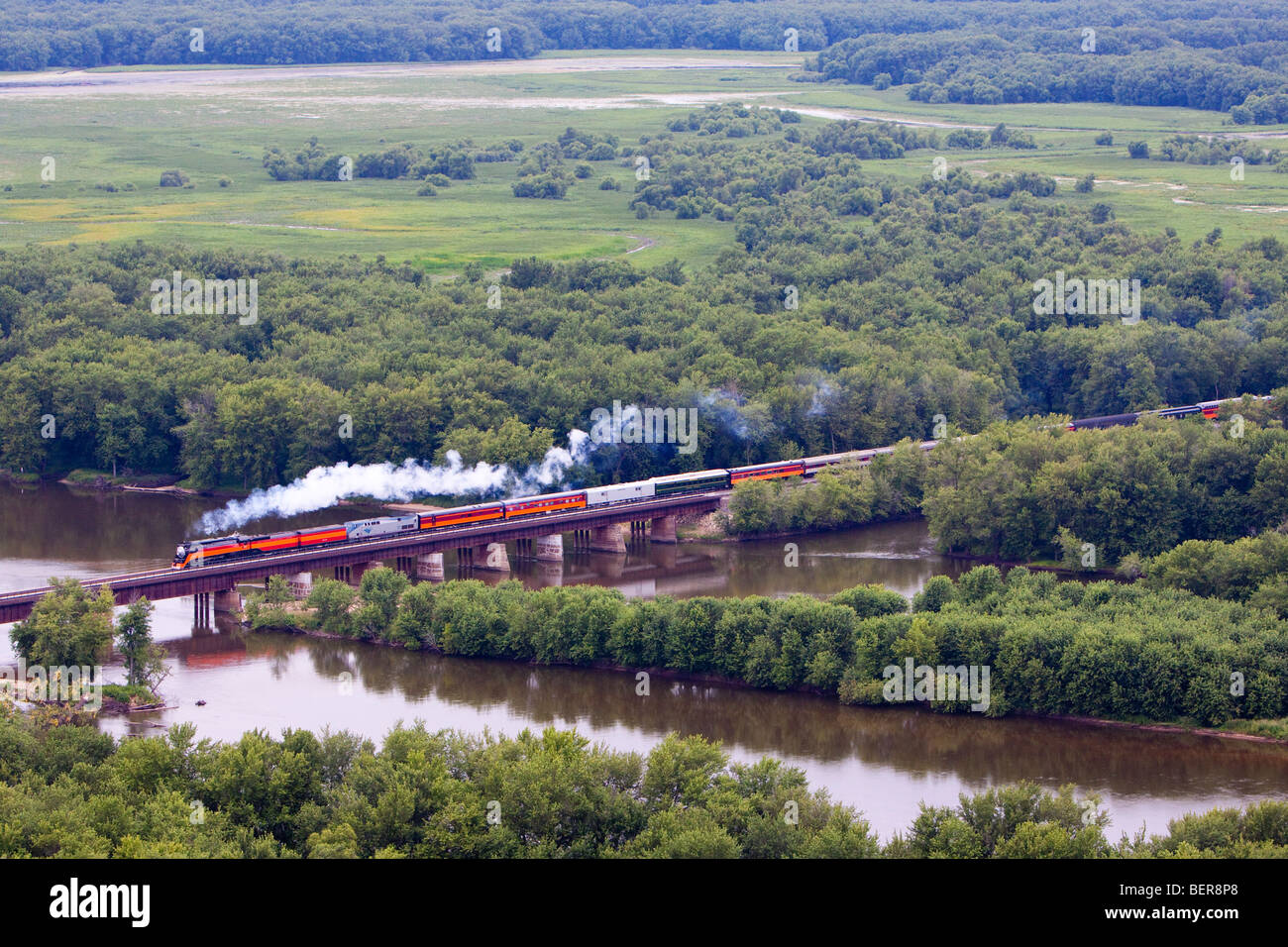 Heading its train over the Wisconsin River, the famous Southern Pacific 4449 steam locomotive is making good time to Chicago. Stock Photo