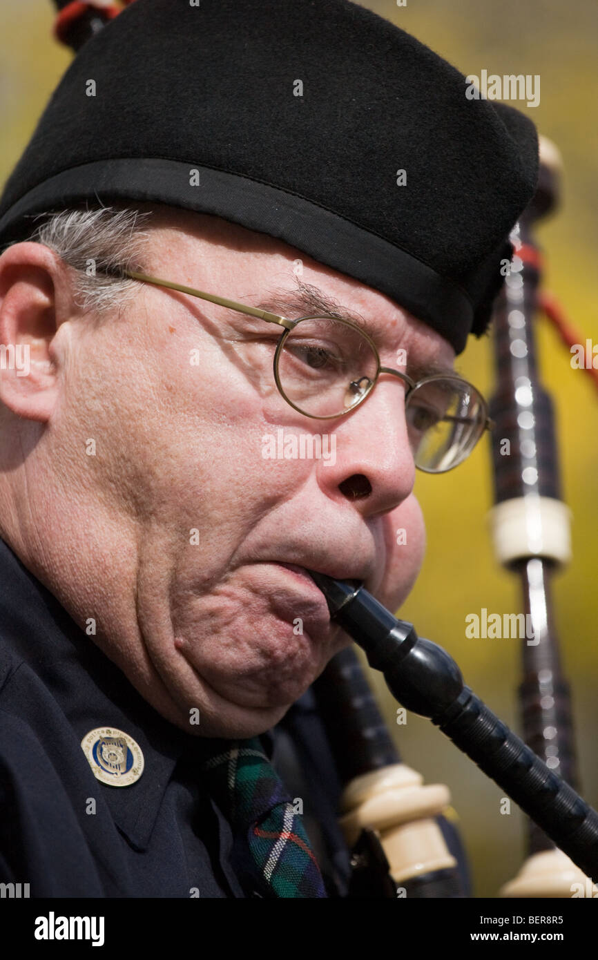 Man blowing bagpipes at Columbus Day Parade, Albany, New York Stock