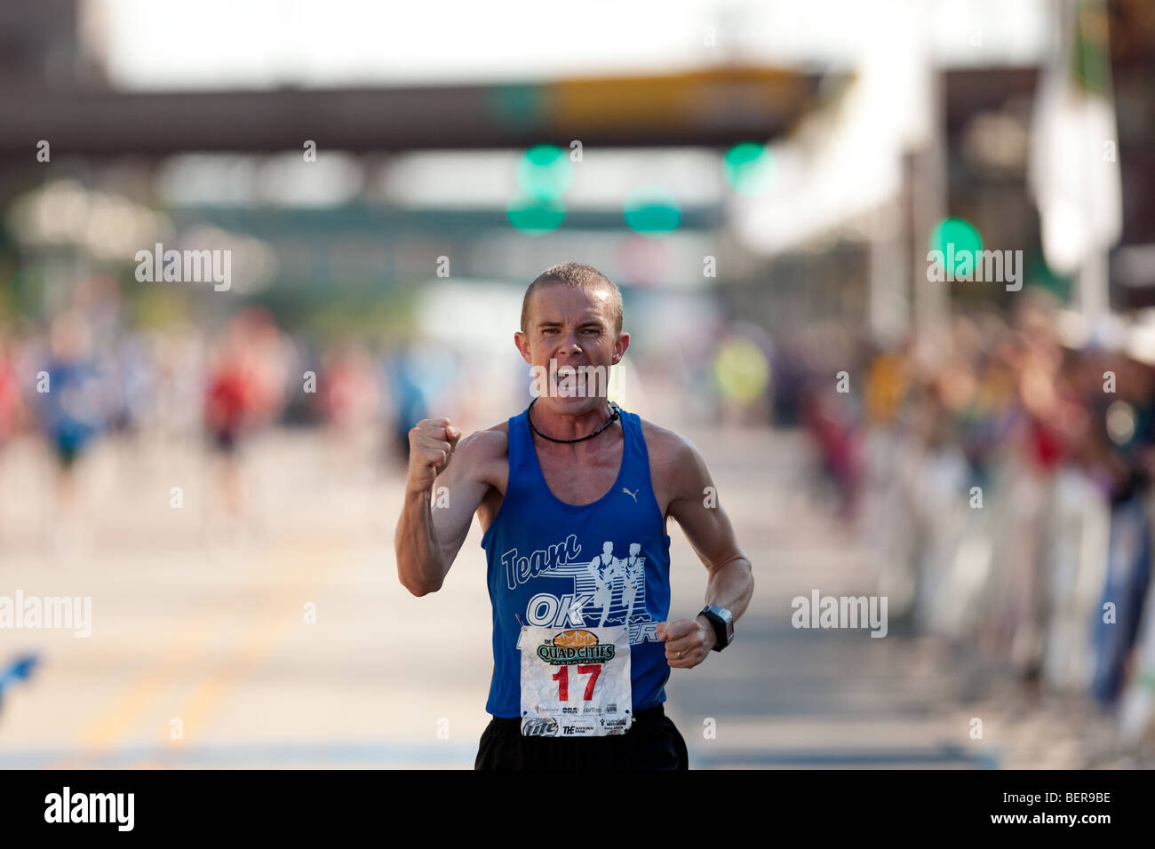 Quad Cities Marathon runner Jerry Faulkner nears the finish, placing in the top five. Stock Photo