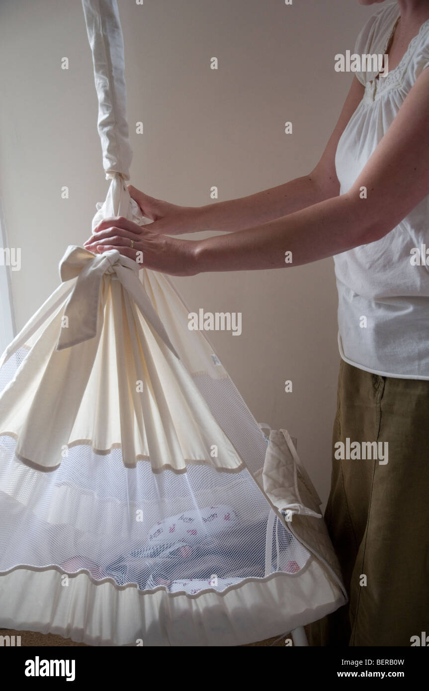 Baby sleeping cot mother hi-res stock photography and images - Alamy