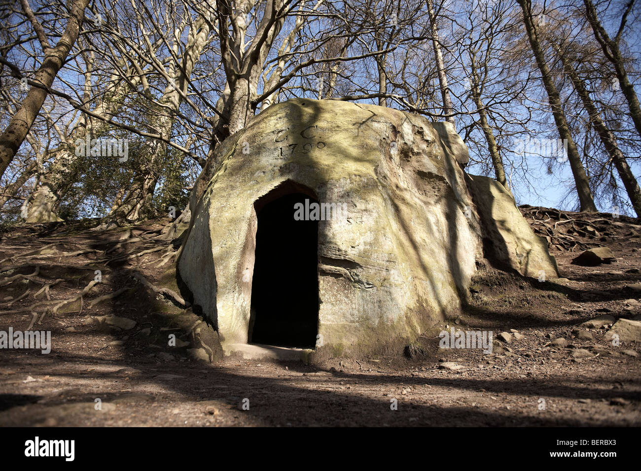 The Hermitage folly carved from solid rock inscribed G + C 1790, Sneaton Wood, near falling foss, North Yorkshire, UK Stock Photo