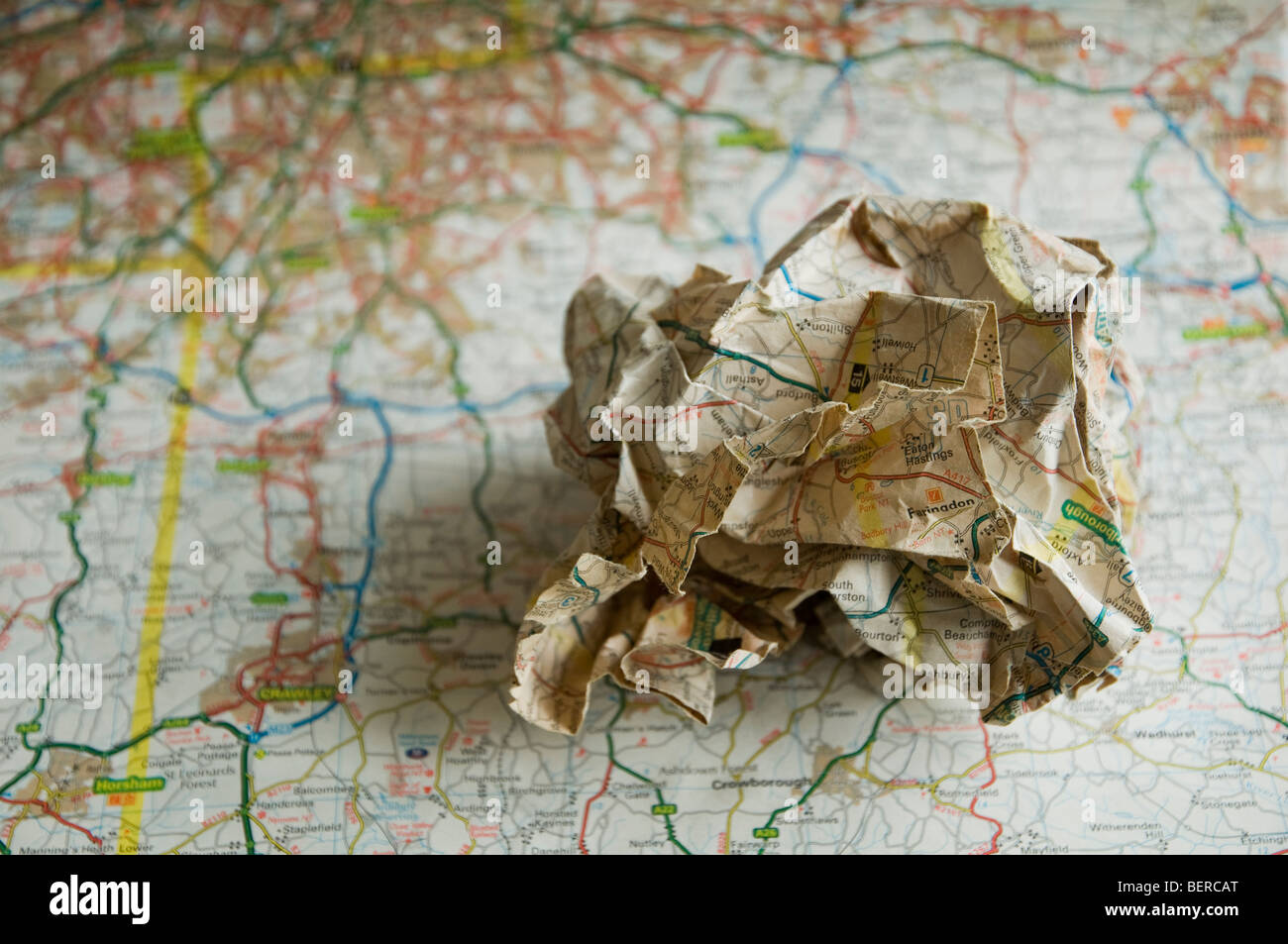 A Scrunched Up Map Placed On A Road Map Of Se England Soft Focus Stock Photo Alamy