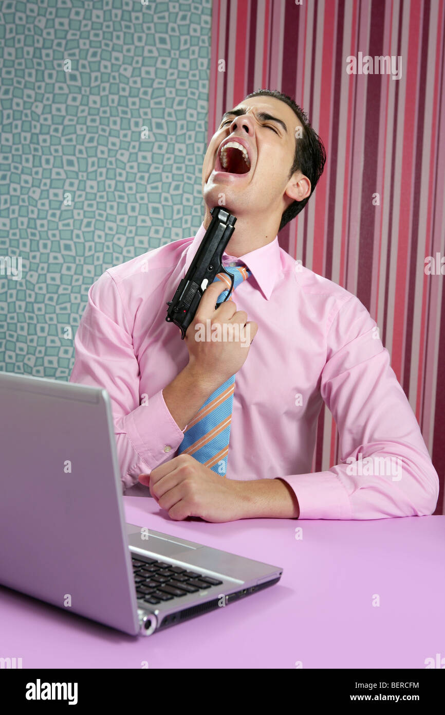 Guy Point Gun At Computer businessman young shooting handgun with computer pink bacground Stock ...