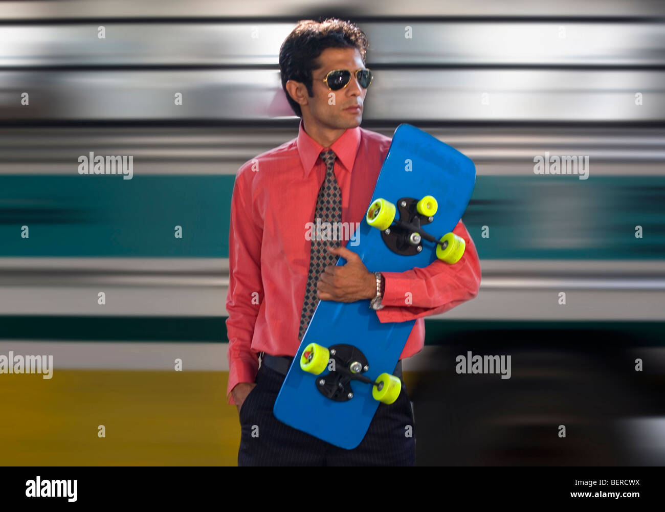 Executive with a skateboard Stock Photo
