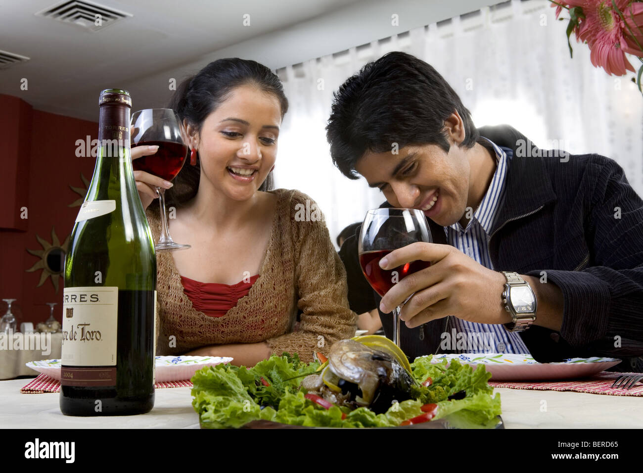 Couple enjoying a meal Stock Photo