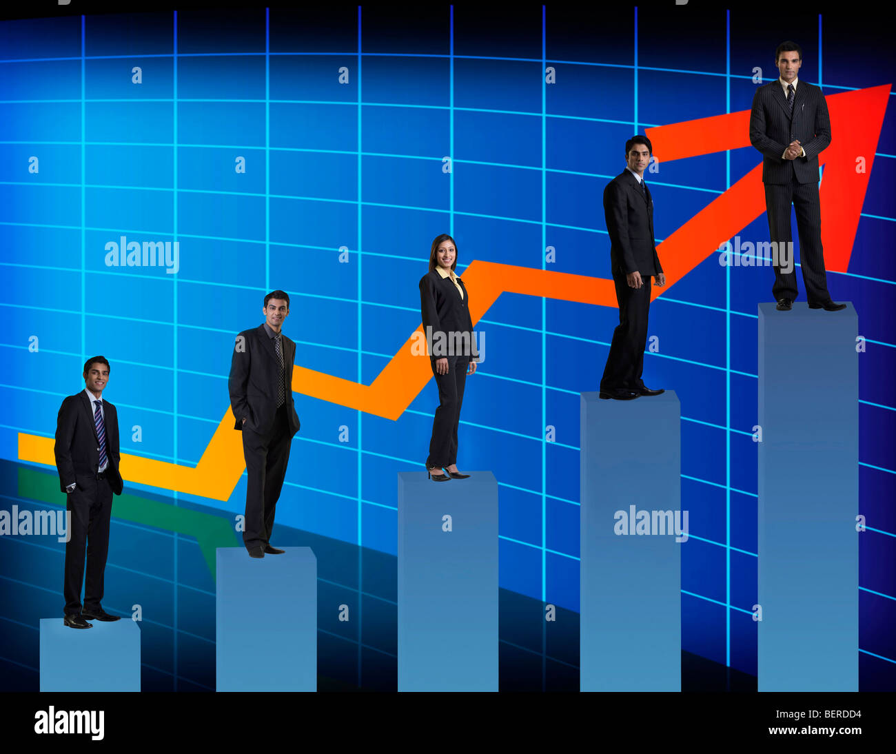 Businesspeople standing on a graph Stock Photo