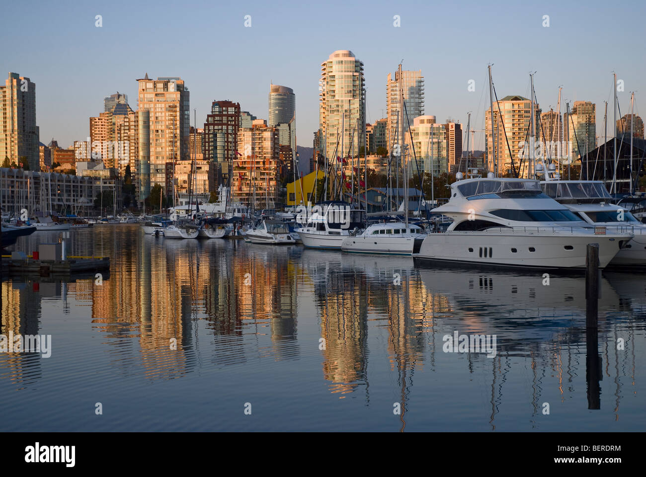 Reflections at sunset, False Creek, Vancouver, Canada. Stock Photo