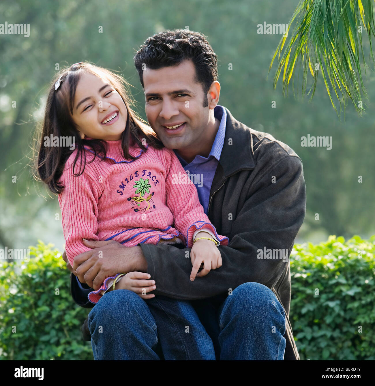 Father and daughter in a park Stock Photo - Alamy
