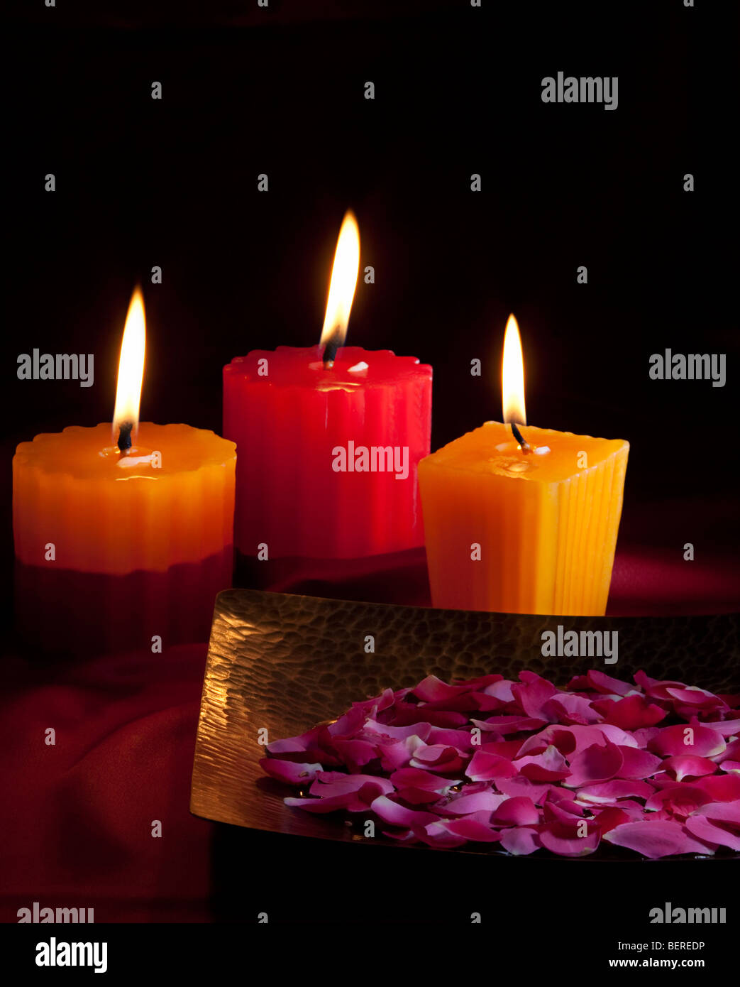 Candles with flower petals Stock Photo Alamy