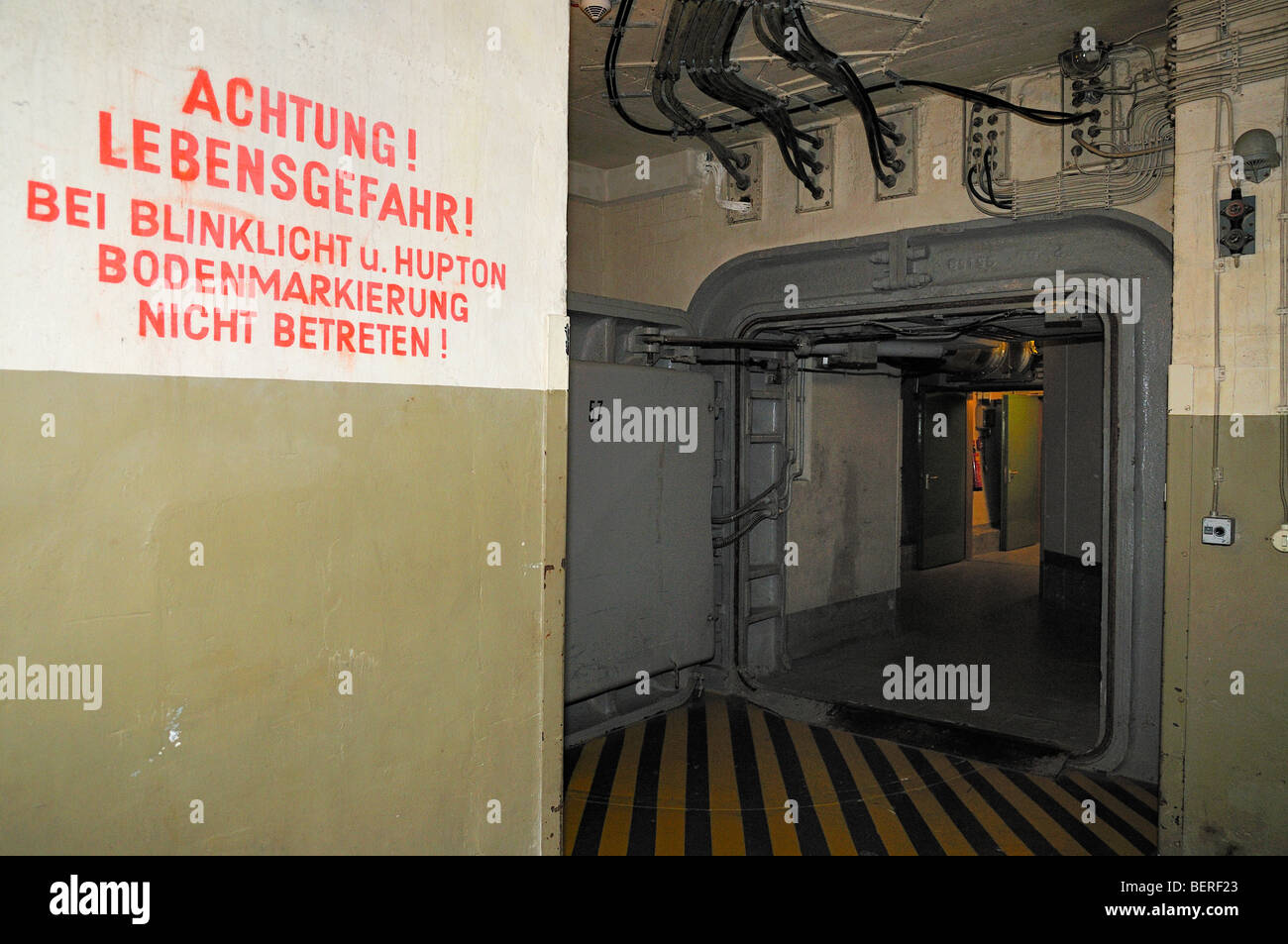 Warning notice in front of  steel door in  former West German government nuclear bunker at Ahrweiler Stock Photo