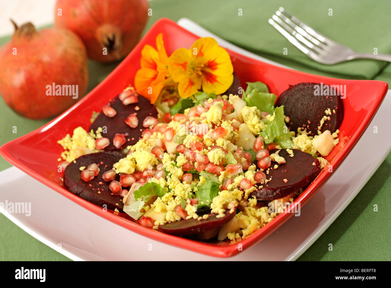 Apples and pomegranates salad. Recipe available. Stock Photo