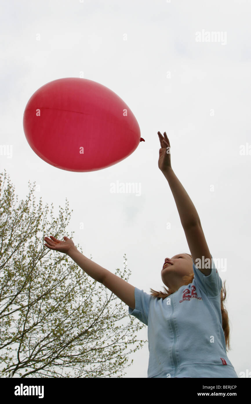 Child play with red balloon flying in the open air, opportunity's, let go  Stock Photo - Alamy