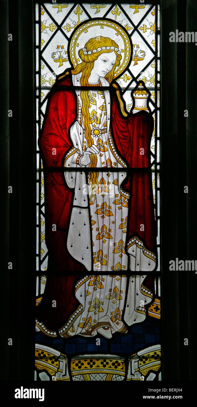 A stained glass window depicting Saint Mary Magdalene by Herbert Bryans (artist E Heasman), St Martin's Church, Glandford, Norfolk Stock Photo