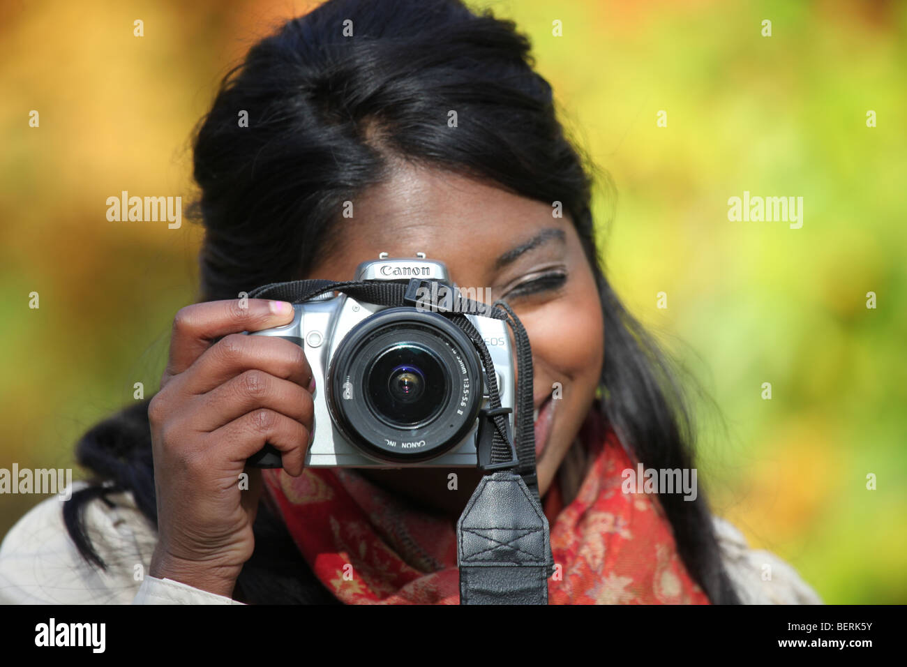 Young Asian Woman taking pictures. Stock Photo