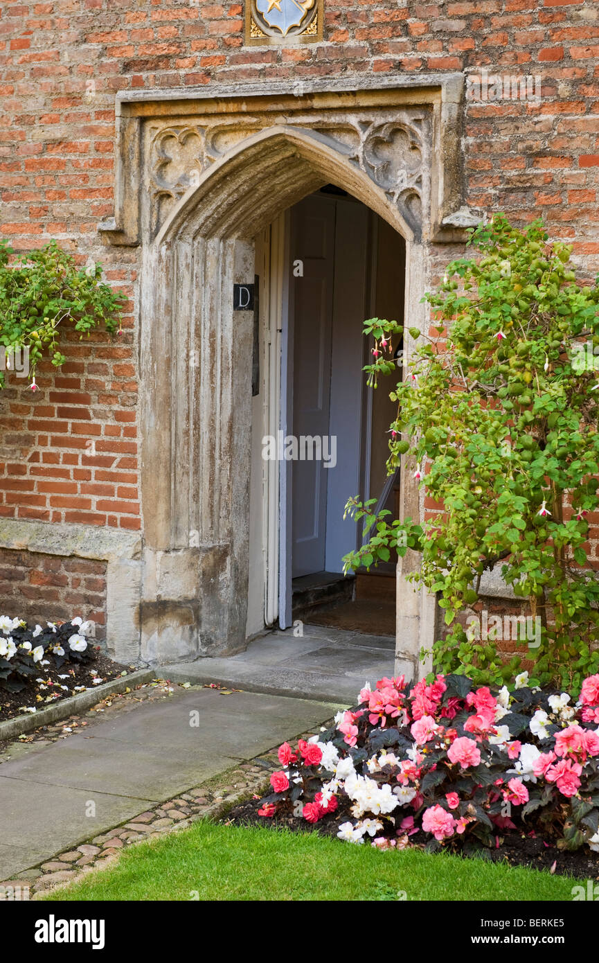 a Gothic styles arched stone doorway; an entrance to a university in Cambridge. Stock Photo