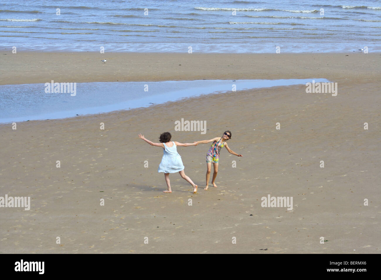 girls having fun on the beach Stock Photo