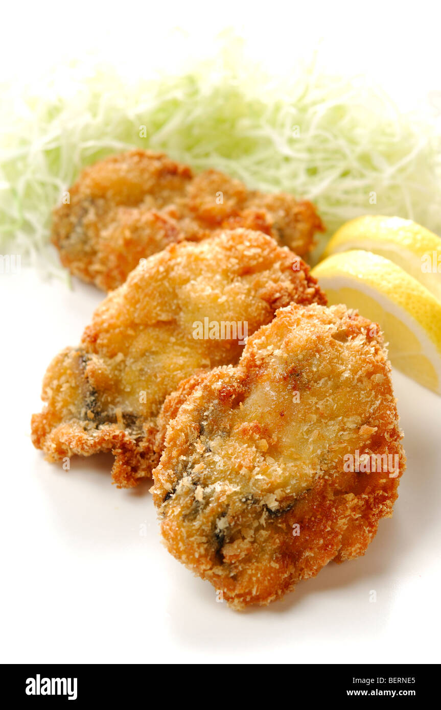 Deep fried oysters, close up, white background Stock Photo