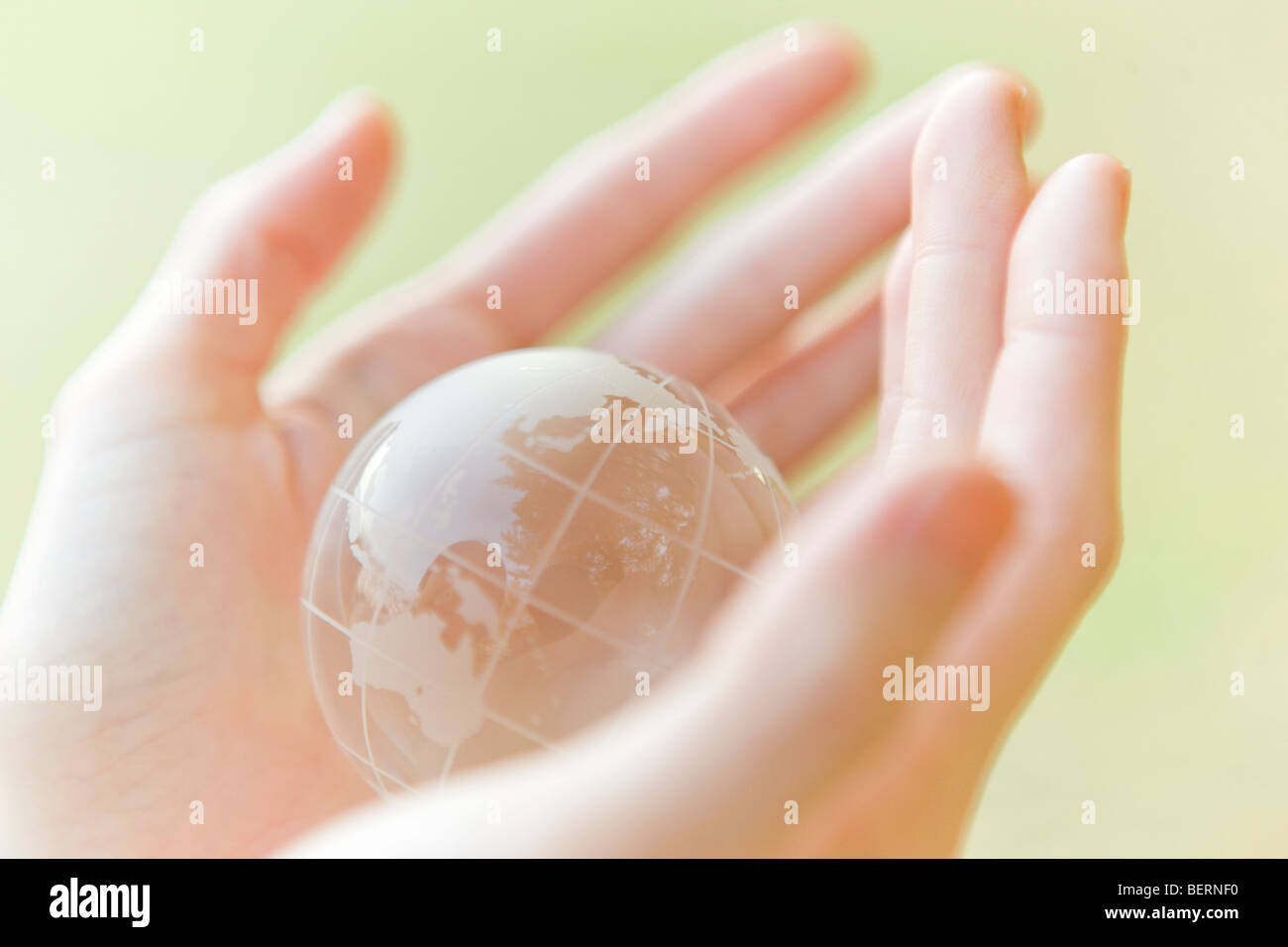 Hands holding up globe hi-res stock photography and images - Alamy