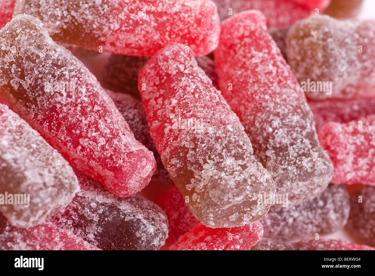 Fizzy Cherry Cola Bottle Sweets: Close-Up Stock Photo