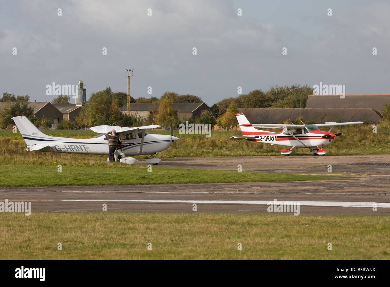 Cessna 182S Skylane G-HRNT & Reims Cessna F182Q Skylane G-ORAY parked after landing at Sandtoft Airfield Stock Photo
