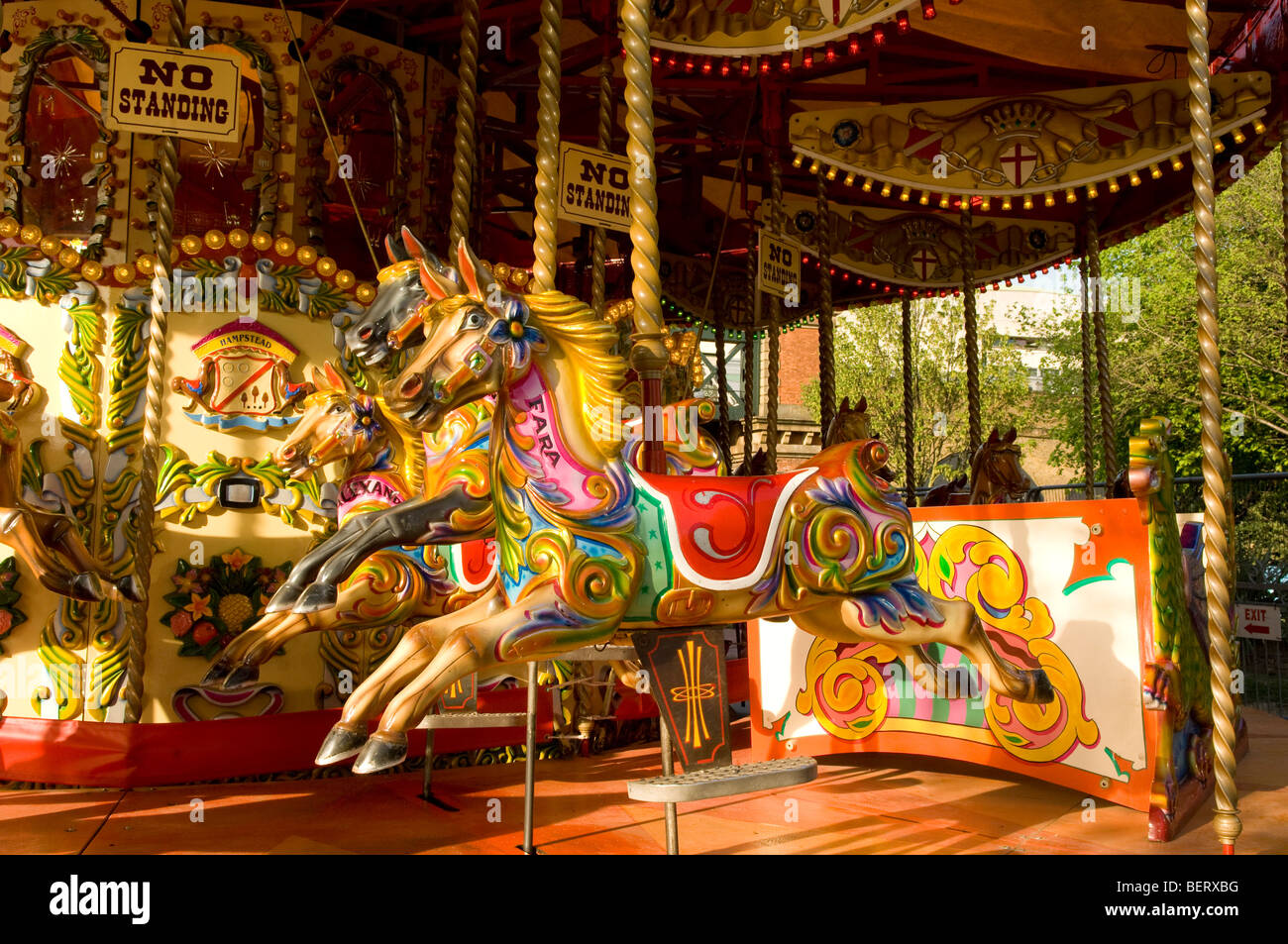 Traditional horse carousel painted in bright colours, London South Bank. Stock Photo