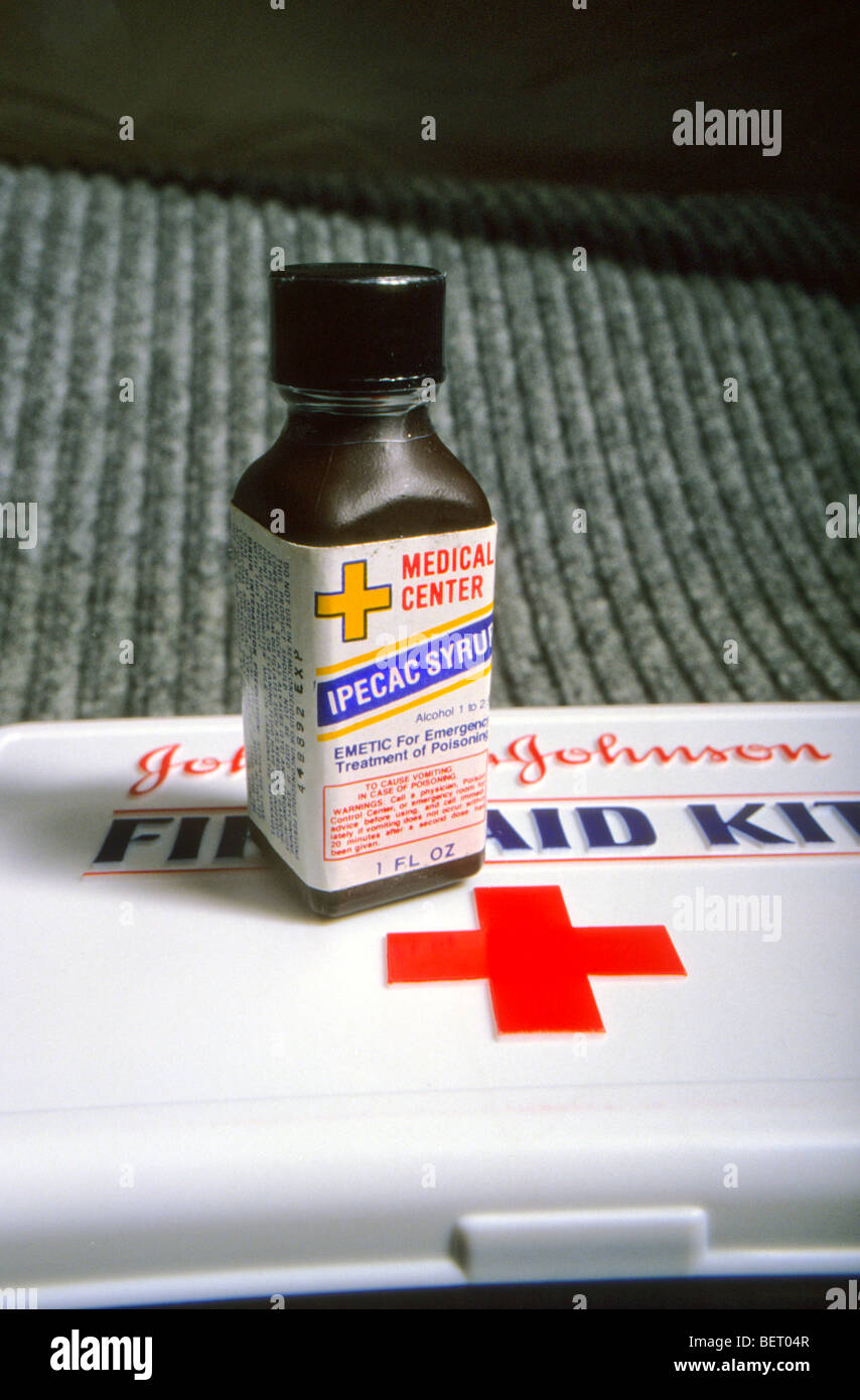 poison treatment rescue risk danger respond response "Johnson & Johnson" first aid kit red cross symbol bottle medicine Stock Photo
