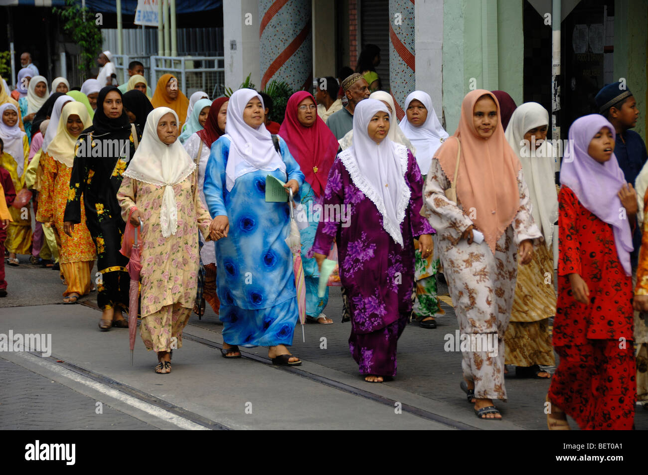 Islamic or Muslim Malay Women or Malaysians in Head Scarves & Religious Procession or Festival of Mohammed's Birthday Georgetown Penang Malaysia Stock Photo