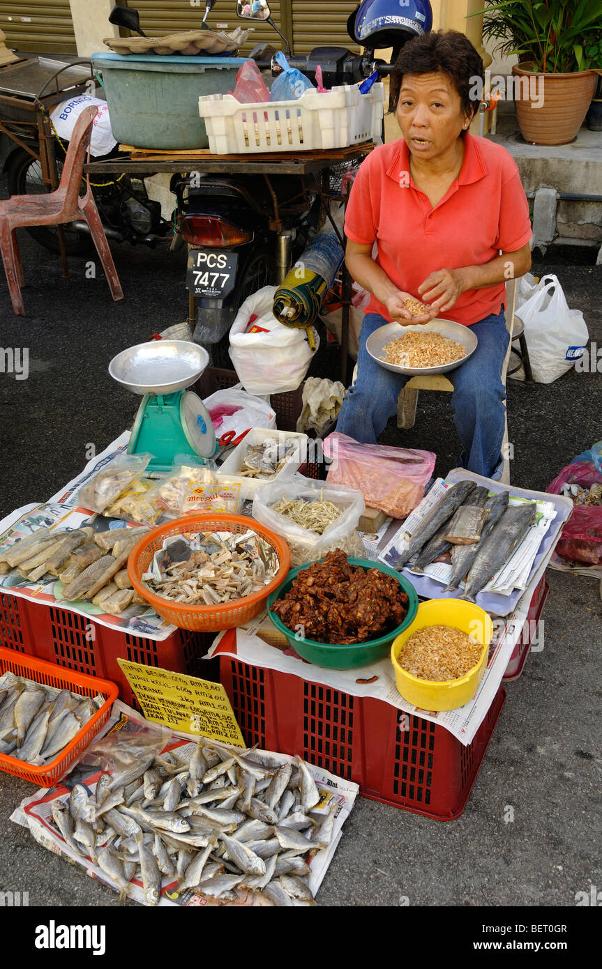Seller or Market Trader at a Fish Stall on a Street Market in