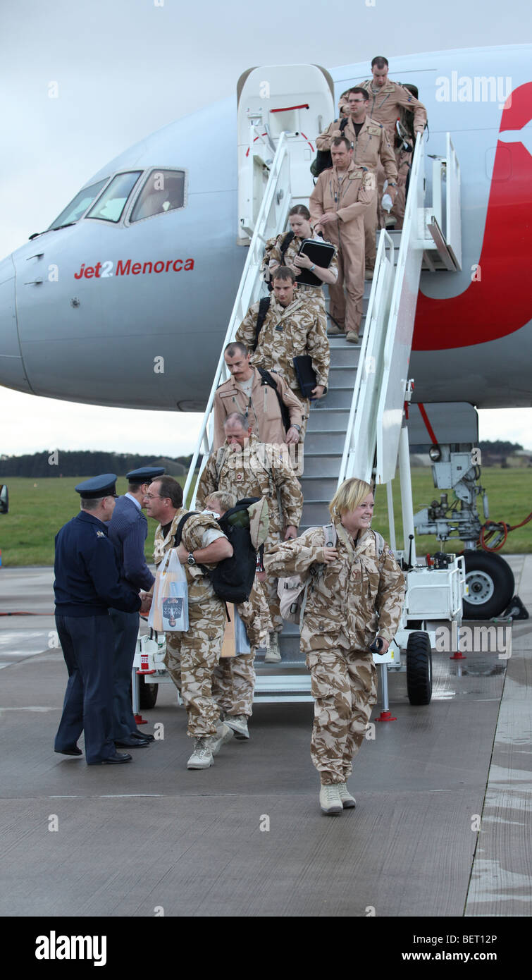 RAF Tornado air and ground crew arrive back by charter jet at their base in Lossiemouth, scotland, after a tour of Afghanistan Stock Photo