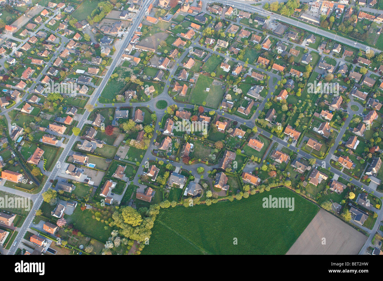 Ribbon development, urbanisation at the border of agricultural area from the air, Belgium Stock Photo
