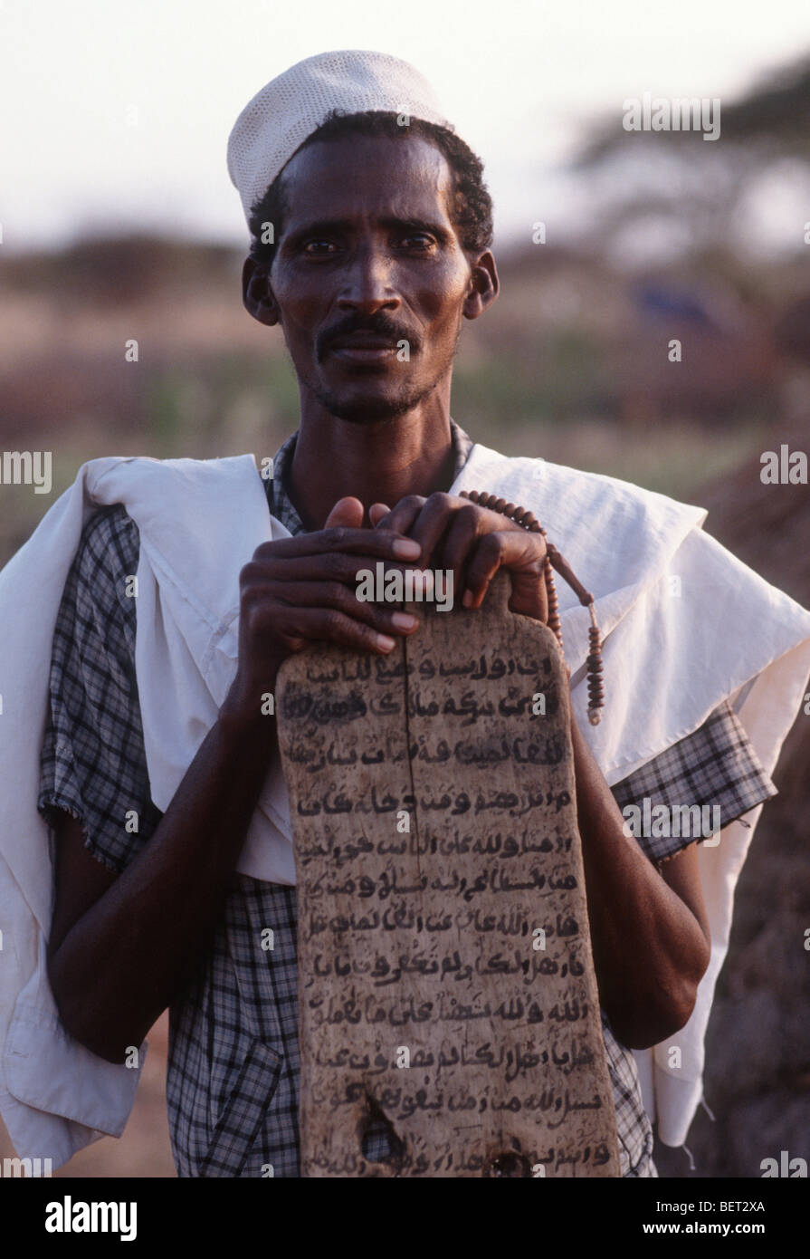 Somali man and prayer board , Wajir, Somaliland, Kenya Stock Photo